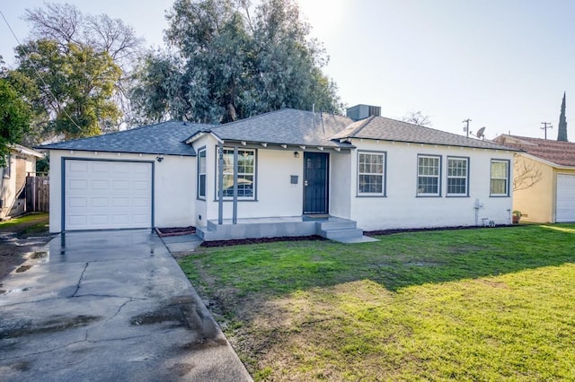 ranch-style house with a garage and a front yard