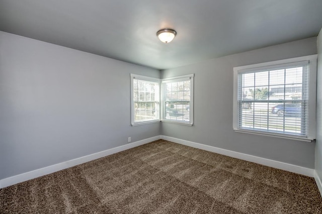 unfurnished room featuring carpet flooring