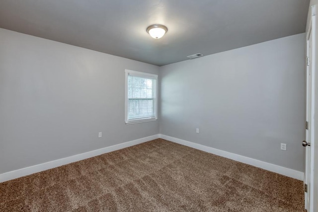 spare room with carpet