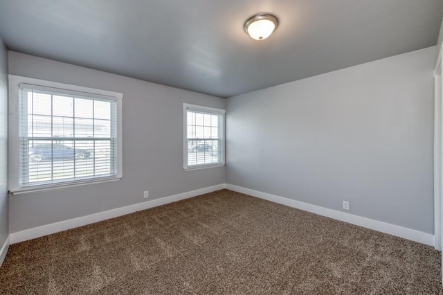 empty room featuring carpet flooring