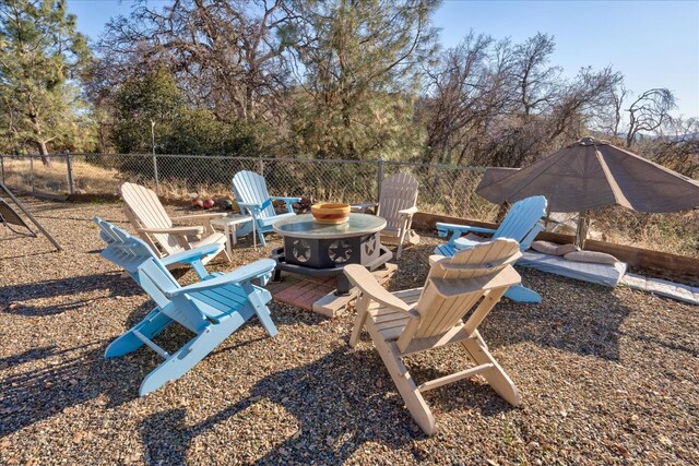 view of yard with an outdoor fire pit