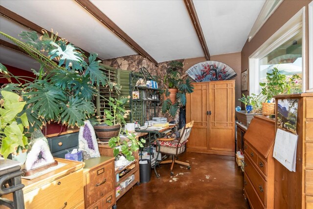 office featuring beamed ceiling