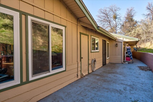 view of side of home featuring a patio