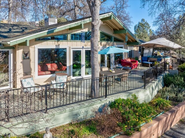 rear view of property featuring french doors