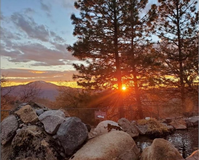 nature at dusk featuring a mountain view