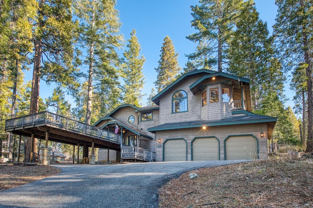 view of front of house featuring a deck and a garage