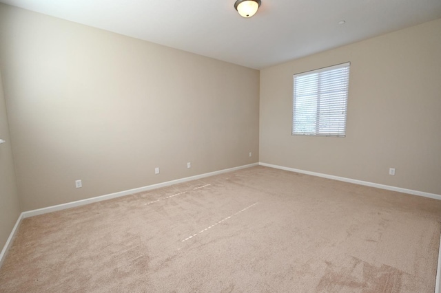 unfurnished room featuring carpet floors