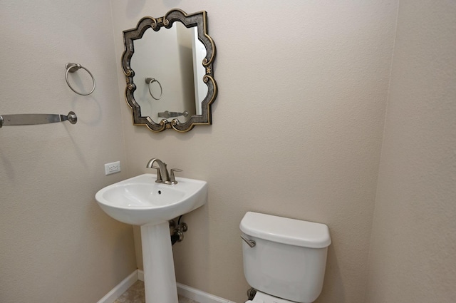 bathroom with toilet and sink