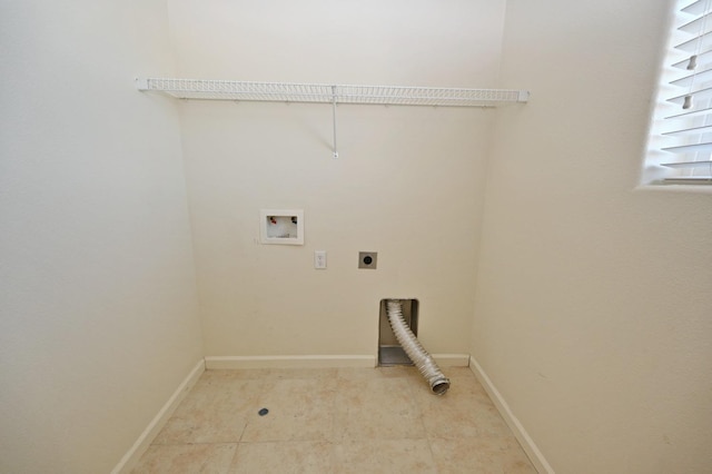 clothes washing area with hookup for an electric dryer, hookup for a washing machine, and light tile patterned flooring