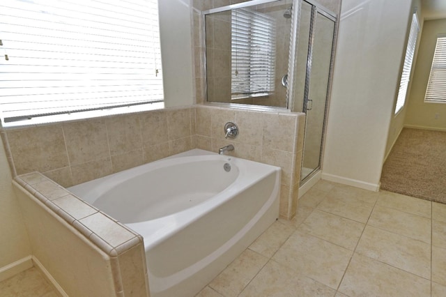 bathroom with plus walk in shower and tile patterned flooring