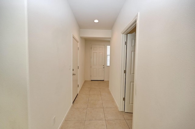 corridor with light tile patterned flooring