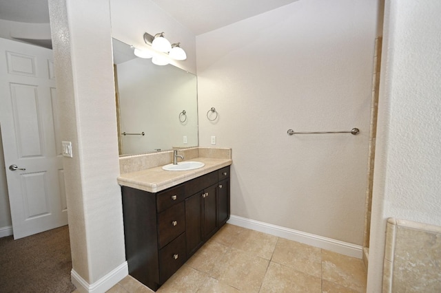 bathroom featuring tile patterned flooring and vanity