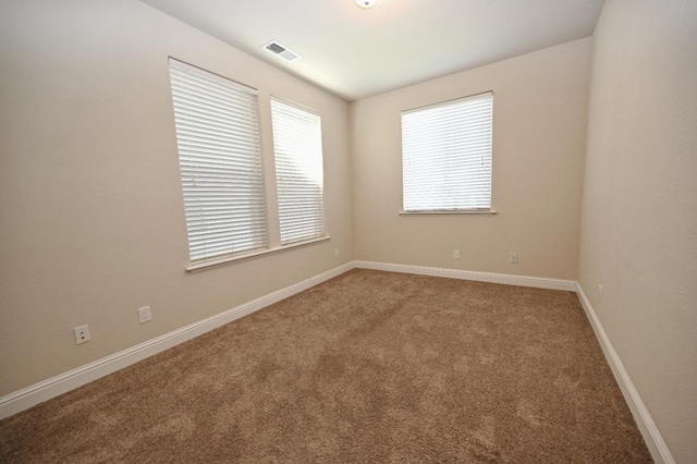 spare room with carpet flooring