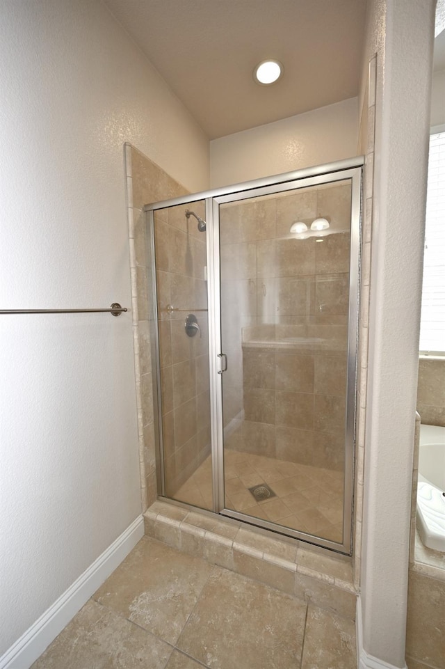 bathroom with separate shower and tub