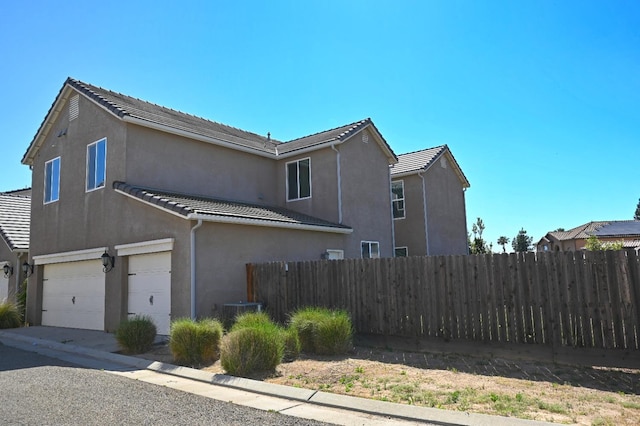 view of property exterior featuring a garage