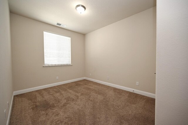 spare room with carpet flooring