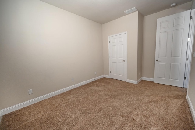 empty room with carpet floors