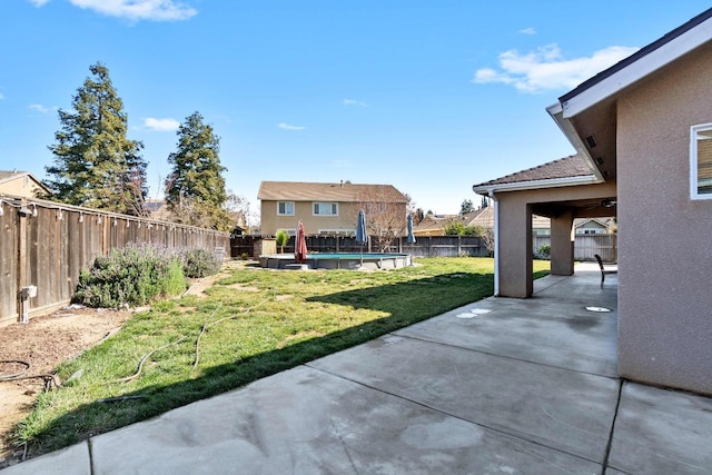 view of yard featuring a swimming pool and a patio