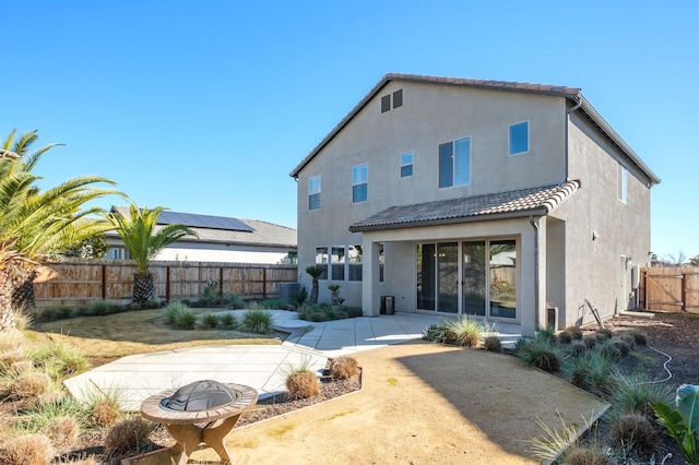 back of property with a patio area