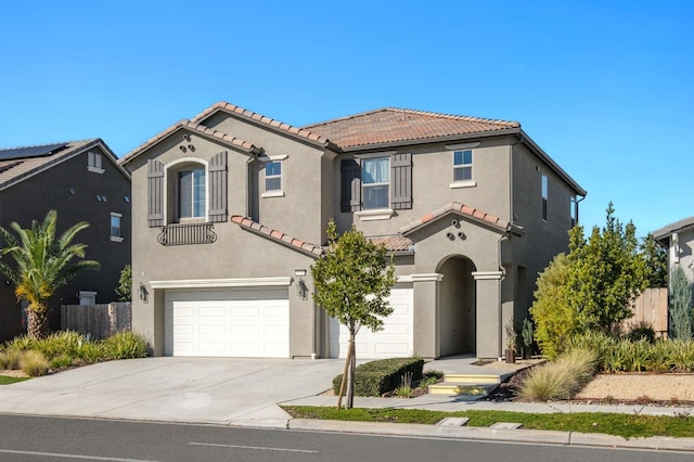 mediterranean / spanish-style house featuring a garage