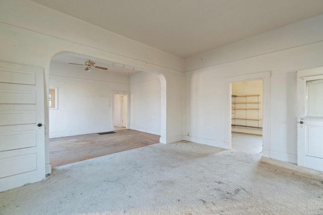 carpeted empty room with ceiling fan