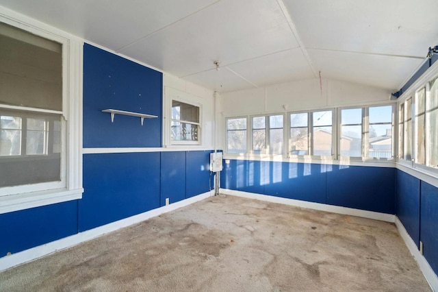 unfurnished sunroom with lofted ceiling