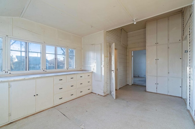 unfurnished bedroom with vaulted ceiling