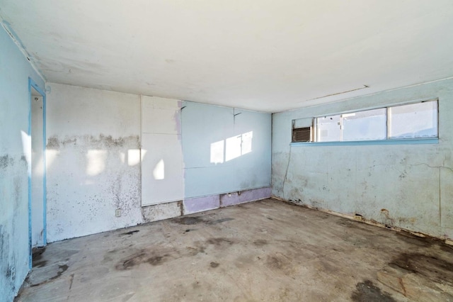 empty room with concrete flooring