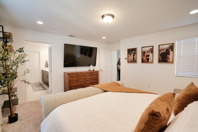 bedroom featuring carpet, connected bathroom, visible vents, and recessed lighting