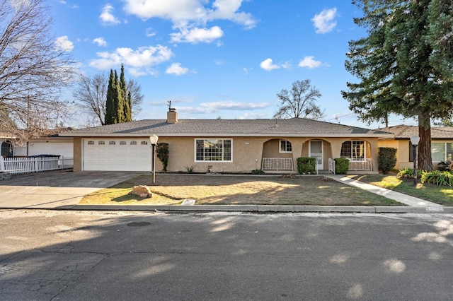 ranch-style home with a garage and a porch