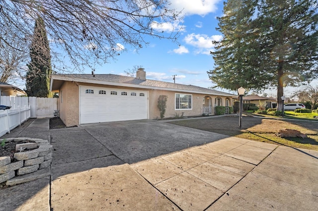 ranch-style home featuring a garage