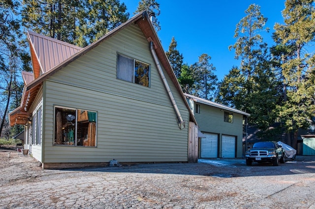 view of side of home with a garage