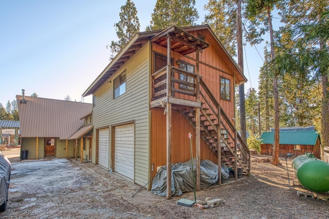 view of property exterior featuring a garage