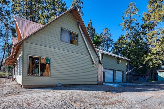 view of side of property featuring a garage