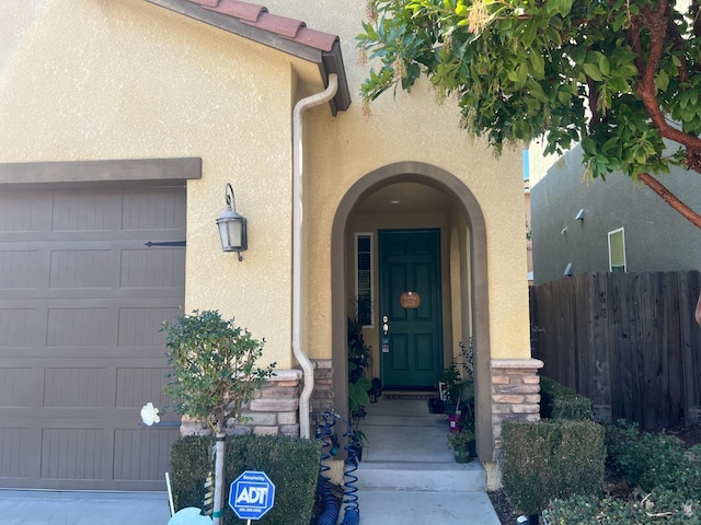 entrance to property featuring a garage