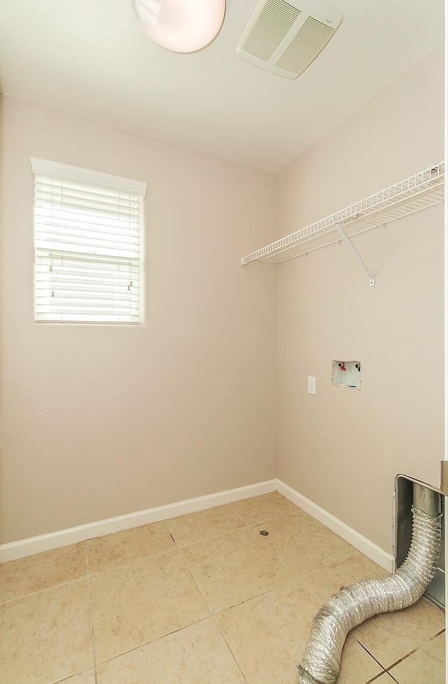 washroom featuring tile patterned flooring, laundry area, washer hookup, visible vents, and baseboards