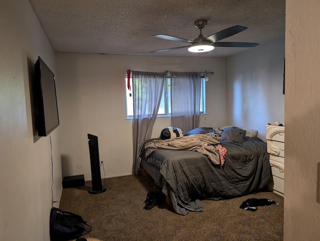 bedroom with a textured ceiling, ceiling fan, and carpet floors