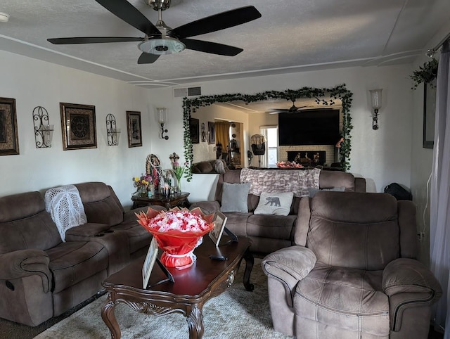 living room featuring carpet floors and a textured ceiling