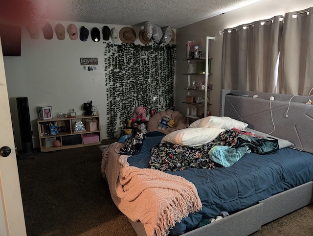 bedroom with carpet and a textured ceiling