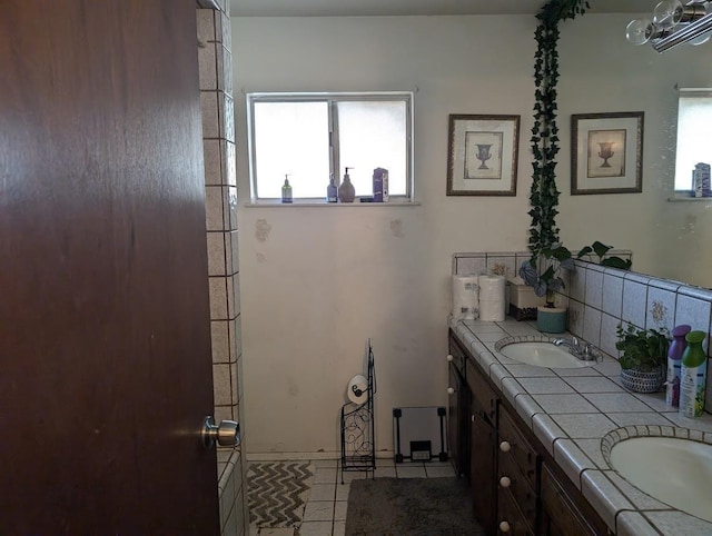 bathroom with vanity and tile patterned flooring