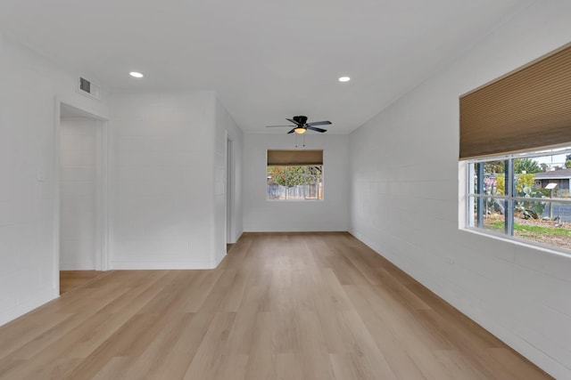 spare room featuring ceiling fan and light wood-type flooring