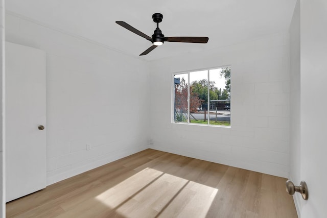 spare room featuring ceiling fan and light wood-type flooring