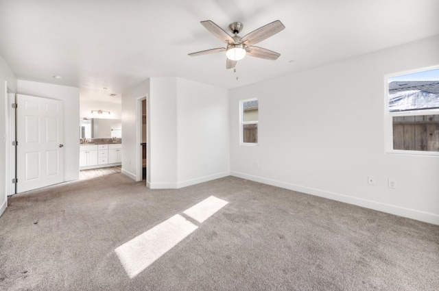 unfurnished living room with light carpet and ceiling fan