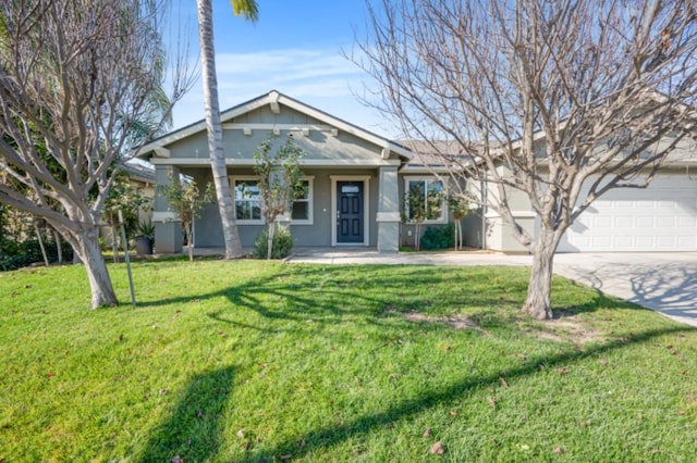 view of front facade with a front yard and a garage