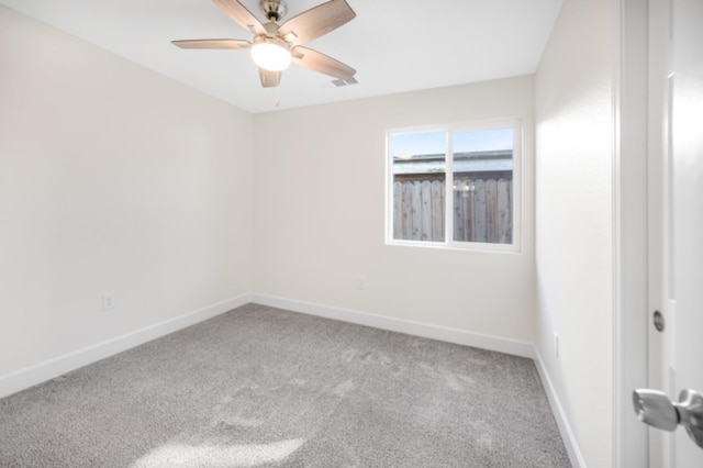 empty room featuring carpet and ceiling fan