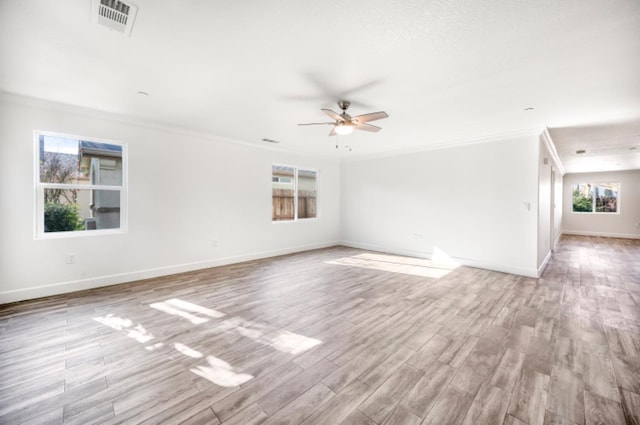 spare room with ceiling fan, crown molding, and light hardwood / wood-style flooring