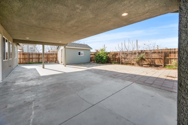 view of patio / terrace featuring a shed