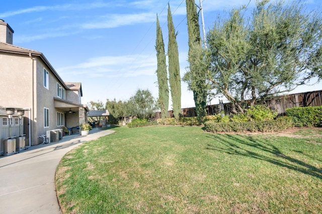 view of yard with central AC unit