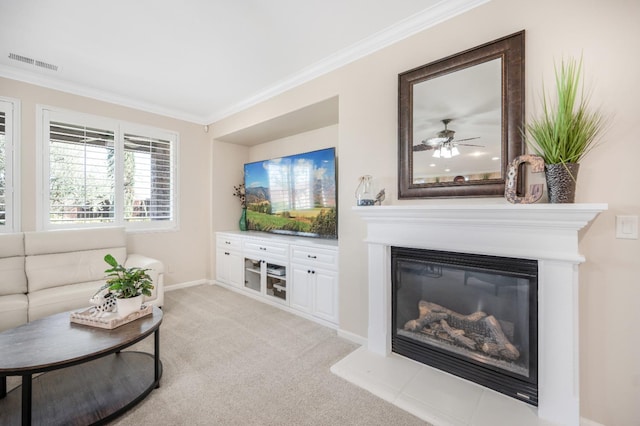 living room with light carpet, ceiling fan, and crown molding