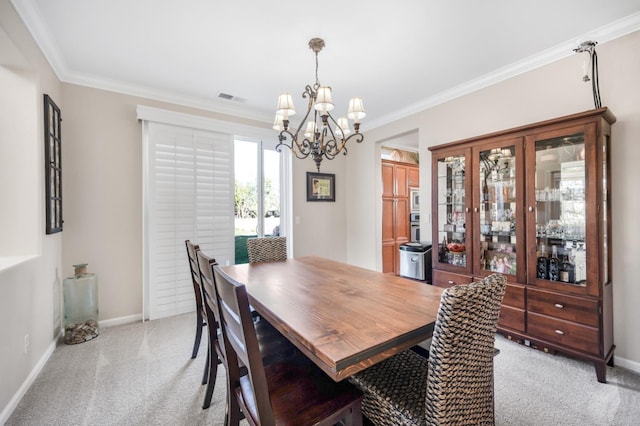 dining area with light colored carpet, a notable chandelier, and ornamental molding